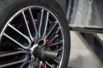 Fototapeta premium Close up of car wheel and rim assembly. 