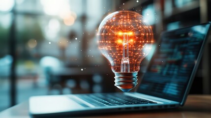 Innovative illuminated light bulb hologram floating over laptop with digital interface in modern workspace scene