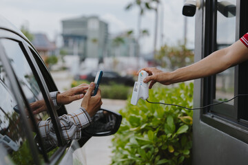 Scan and pay for food, pick up food from a drive-thru counter and take it to eat at home and at work.