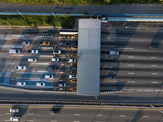 A highway where cars are paying tolls.