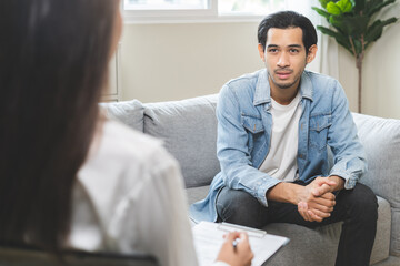 Psychology, depression. Suffer asian young man consultation with psychologist while patient...