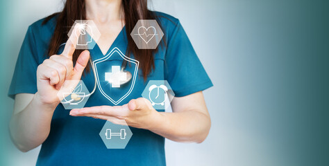 A female doctor is selecting medical icons on a virtual screen for the concept of healthcare and...