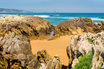 Rock formations on Liencres beach belonging to the Quebrada coast of northern Spain, Cantabria.