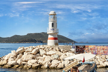 Kaş, the marina entrance and lighthouse. Kaş is one of the most beautiful tourist destinations in the Mediterranean. Antalya - Turkey