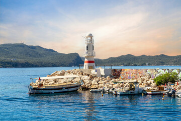 Kaş, the marina entrance and lighthouse. Kaş is one of the most beautiful tourist destinations in the Mediterranean. Antalya - Turkey