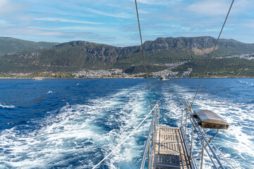 View of Kaş from the sparkling blue sea. Kaş is one of the most well-known and beautiful tourist destinations in the Mediterranean. Antalya - Turkey