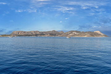 Naklejka premium A beautiful view from the sea of Meis-Kastellorizo, a Greek island in the Mediterranean famous for its Lego-like structures.