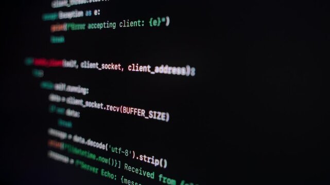Close-up of code running on a black screen, showing lines of a backend program