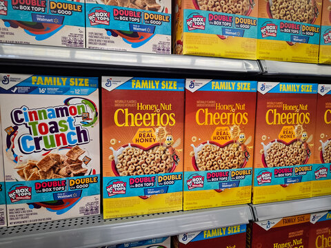 Boxes of Honey Nut Cheerios and Cinnamon Toast Crunch cereal from General Mills on a retail shelf on July 10, 2025 (Minneapolis, USA). For Editorial Use.