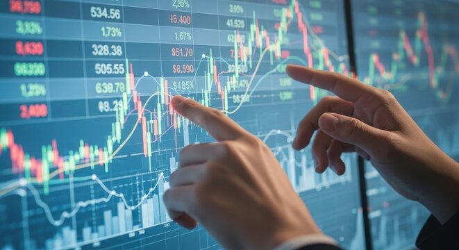 Closeup of hands pointing at stock market data