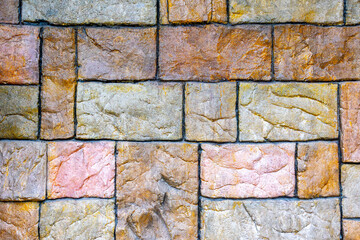 Colorful stone brick wall with diverse texture patterns and natural vibrancy