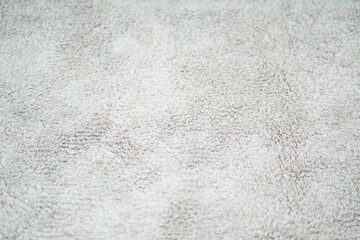 Fototapeta premium The texture of the fabric on the carpet is light gray