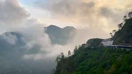 view of Vaishno Devi Shrine in India, clouds over the mountains in Jammu hills at Vaishno Devi shrine, Temple in Jammu