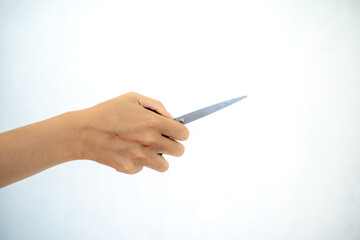 hand holding scissors white background isolated