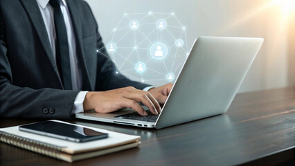 Businessman typing on laptop with glowing network connections and people icons overhead