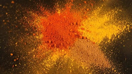 turmeric and paprika spice powder explosion against black backdrop - Powered by Adobe
