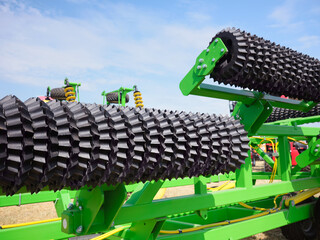 Agricultural roller for soil cultivation in fields. Preparing the seedbed before sowing.