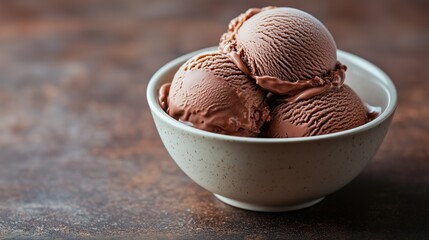 Delicious chocolate ice cream scoops in ceramic bowl