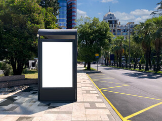 An empty advertising banner for a bus stop against a beautiful sky in the city.
