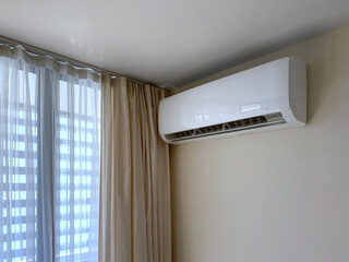 Air conditioner on the wall works at home or apartment.