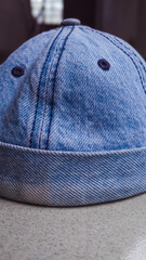 Close-up of a stylish denim docker prayer cap