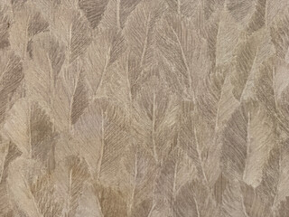 Close up of beige cream wallpaper in feather fur and leaves shape pattern. Suitable for luxurious and elegant wall covering. Seamless background texture.
