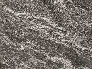 Natural black and grey marble with random white veins. Luxurious rare type of slate stone and...