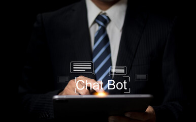 Businessman using a digital chatbot on a tablet for automated customer service and AI-powered business communication