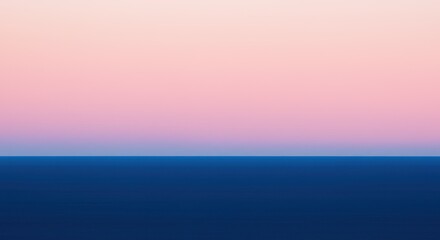 A gradient sky fades from pink to blue meeting a darker blue expanse likely water