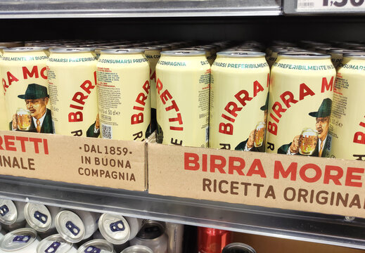 Rome, Italy - July 13, 2025: Birra Moretti beer cans displayed on a supermarket shelf, showcasing the iconic design and branding of this traditional Italian lager