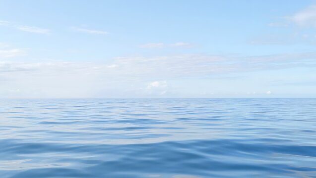 Serene blue ocean horizon under a softly clouded sky with gentle ripples on the water surface