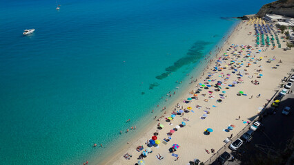 Aerial view of the colorful beach and turquoise sea at Tropea, Calabria, a popular tourist...