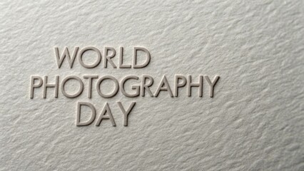Celebrate World Photography Day with this textured paper background and embossed lettering for a creative design