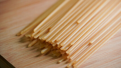 colse-up of spaghetti on a wooden board