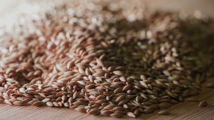 a pile of birdseed on a wooden table