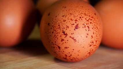 closeup of an egg on a wooden board