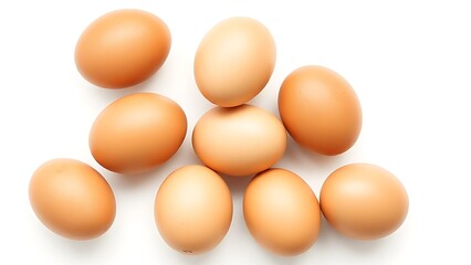 Brown eggs on a white surface, showcasing natural texture and subtle shadows in a minimalist composition.