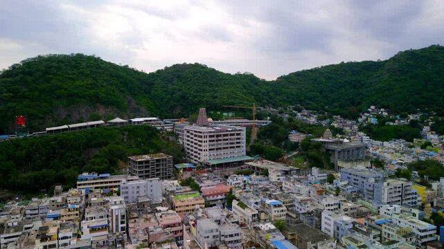 Aerial view of South Indian city Vijayawada on a cloudy day , Famous hindu godess Kanaka Durgha temple on the hills in the Andhra Pradesh state of India.