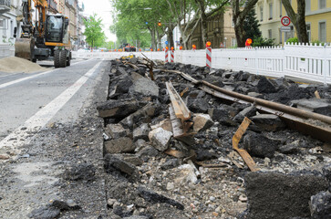 Demolished tram tracks on a city road.