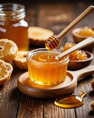 Golden honey pours from a wooden dipper into a glass jar, showcasing its rich texture.