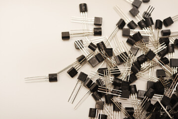 A scattering of plastic transistors. A bipolar transistor for electronics.