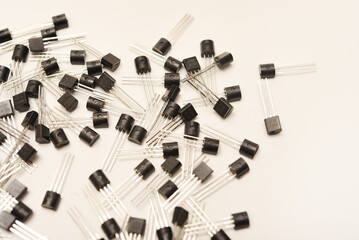 A scattering of plastic transistors. A bipolar transistor for electronics.