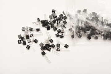 A scattering of plastic transistors. A bipolar transistor for electronics.