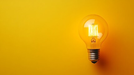Vintage Edison Lamp on Bright Yellow Background, Creative Idea Concept