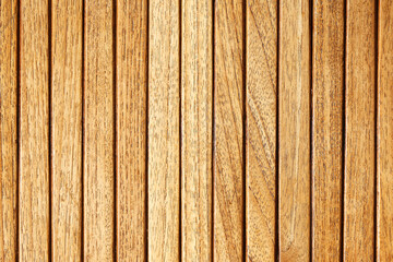 Wooden slatted wall panel. Natural brown wood texture. Vertical planks background. Rustic surface...
