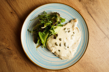Chicken breast in creamy caper sauce