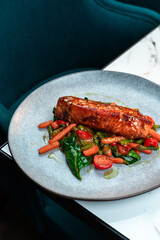 Pan-Seared Salmon with Spinach and Glazed Vegetables. Ideal for restaurants, healthy menus, cookbooks.