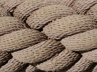 Thick twisted rope as maritime design feature in park. Ideal for design projects. Textured and...