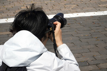 Korean or Chinese photographer on Red Square in Moscow