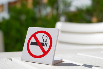 No smoking sign on the table. Attention, do not smoke. 